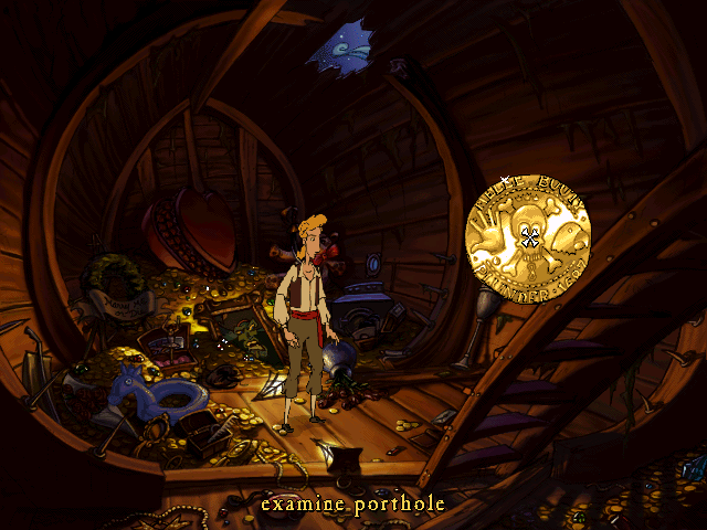 A screenshot from Curse of Monkey Island that looks like an interactive cartoon, showing the pirate protagonist exploring a ship’s hold full of treasure. The interface is displayed as a pop-up of a gold doubloon, with exaggerated icons for a hand, a skull with eyes, and a parrot head.