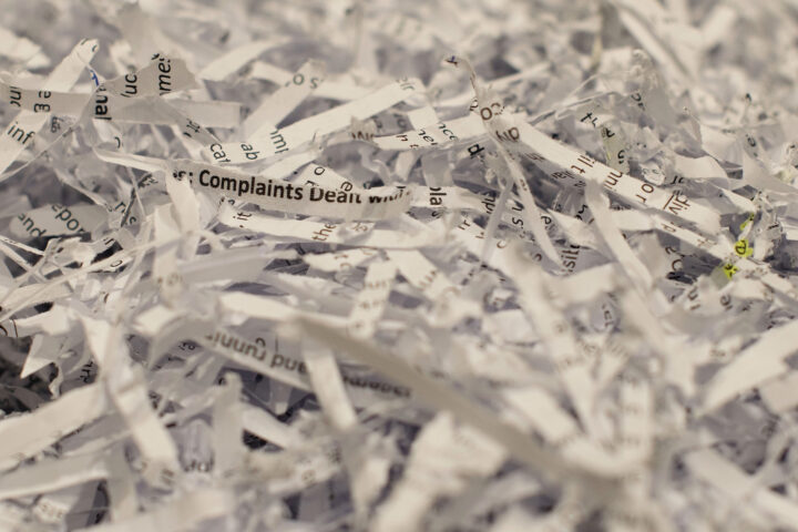 A closeup of shredded paper, in focus in the middle, blurry at the edges.